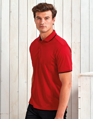 CONTRAST COOLCHECKER POLO - A smart choice for businesses looking for workwear that reflects company branding, these polo shirts offer a two-tone contrast colouring. The ribbed knit collar and cuffs is colour tipped as is the neckband and placket. There is a three button fastening on the placket for a casual unbuttoned look or smart fastened up style. The Coolchecker fabric is designed to draw moisture away from the body and encourage air flow, so the wearer remains fresh and cool throughout the day. Side panels create an aesthetically pleasing fitted style for men. Side panels for a fitted shape Ribbed knit collar 3-button placket 100% Polyester 155gsm Domestic wash 40
